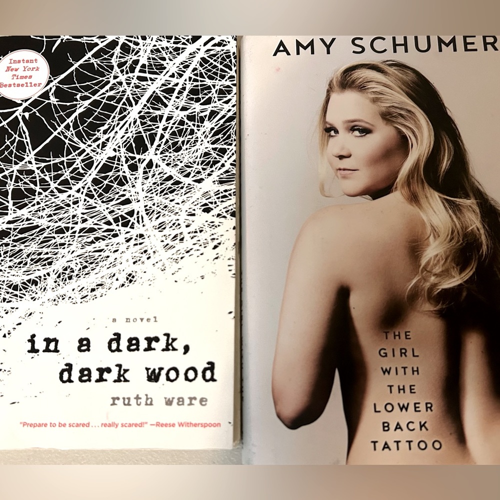 Two books: Amy Schumer’s Autobiography and “In a dark,dark wood” by Ruth Ware